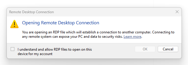 The first-launch educational dialog shown once per user account after installing KB5083769, explaining what RDP files are and the associated phishing risks.